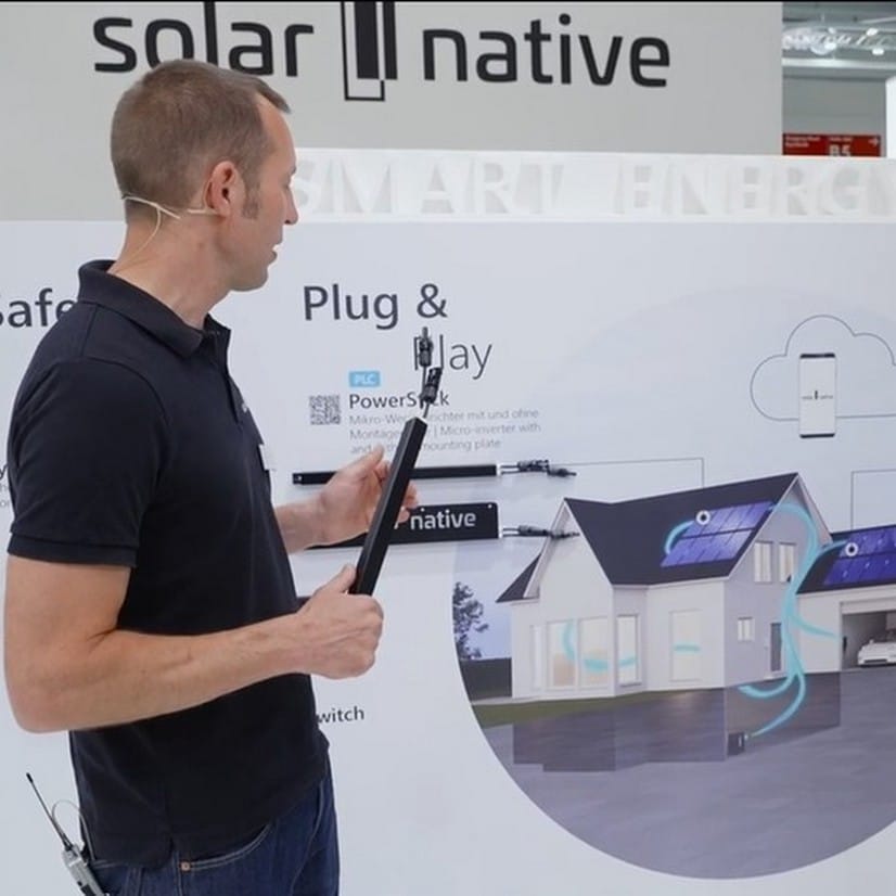CEO Julian with microinverter in the interview with photovoltaik